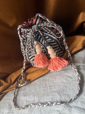 Jasper and Jeera Tassel Drawstring Bucket Bag - Black & Coral